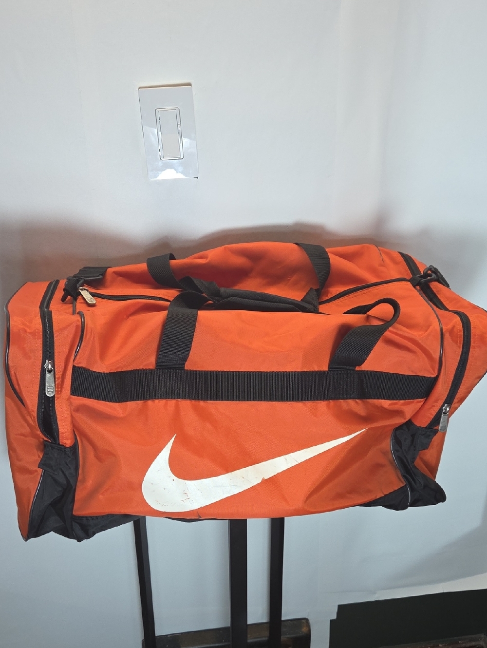 Nike Men’s Orange Duffel Bag with White Swoosh and Black Accents